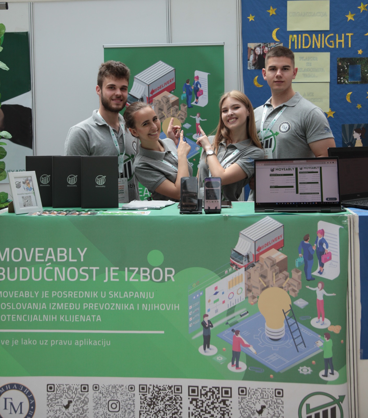 Moveably team at the booth